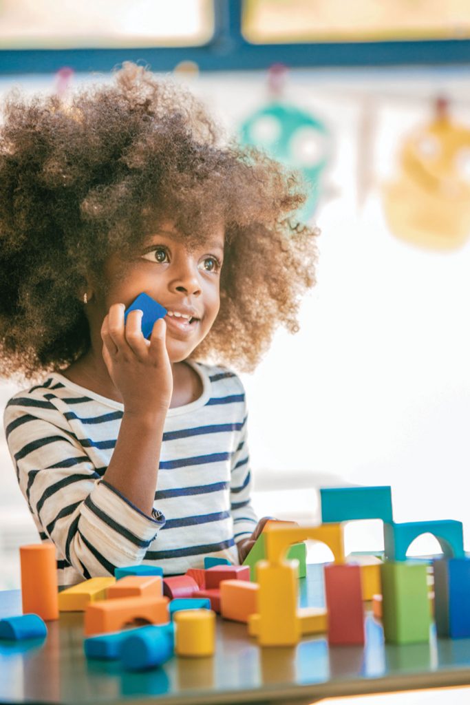 Girl with blocks | About Pediatric Physical therapy