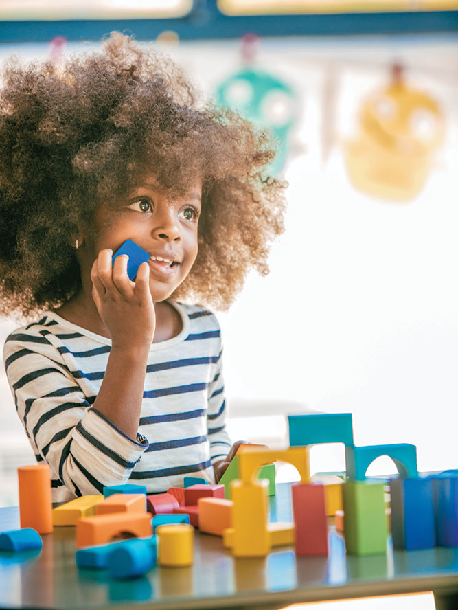Girl in a wheelchair looking over her left shoulder | Careers in occupational therapy