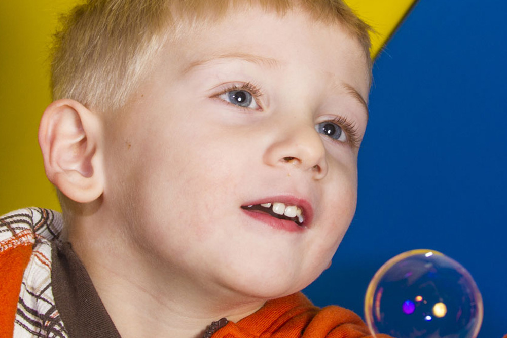 Young boy looking up to the right