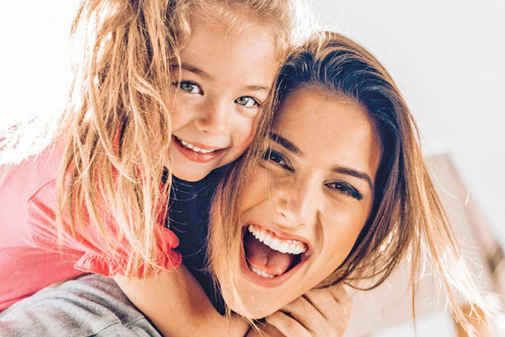Little Girl hugging mother | Occupational Therapy